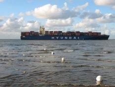 Container ship on its way to Hamburg near Altenbruch