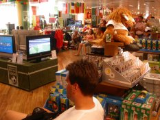 Many people watching football in Karstadt department store