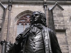 Johann Sebastian Bach in front of the St Thomas Church in Leipzig